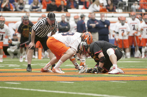 Syracuse's Mike Iacono (left) and Maryland's Charlie Raffa (right) square off at the faceoff X in Maryland 16-8 win over the Orange on Saturday. Raffa dominated at the X and helped Maryland to the win.  