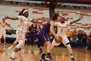 Gabby Cooper (left) scored a career-high 19 points and Alexis Peterson added 27 in SU's ninth victory of the season. 