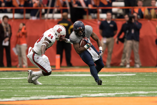 N.C. State's Shawn Boone sets up to tackle an SU ball-carrier.