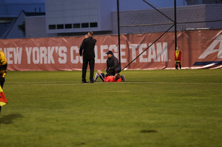 SU support staff assist with Castle's injury to the leg. 
