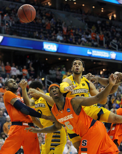 Trent Lockett #22 of the Marquette Golden Eagles loses the ball against C.J. Fair #5.