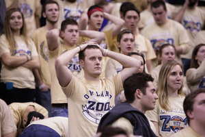 A Pittsburgh fan looks on in disbelief as Tyler Ennis' shot shocks all in attendance. The buzzer-beater pushed No. 1 Syracuse 58-56 over No. 25 Pitt in stunning fashion, and inserted the freshman into program history. 