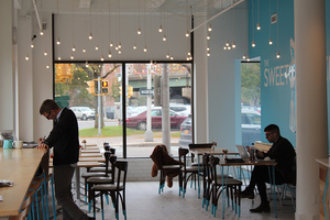 The Sweet Praxis is a modern bakery in Armory Square that provides vegan and gluten-free items and signature espressos while focusing on green practices like using compostable packaging.