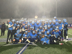 Indian River poses with its regional championship plaque after winning big at Cicero-North Syracuse on Friday night.