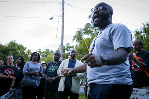 Syracuse residents gather at a vigil last fall for five people shot on Midland Avenue. 