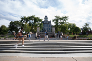 Students walk to class with masks during the spring semester.