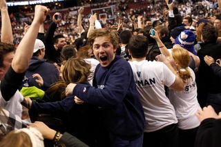 Villanova fans storm the court. 