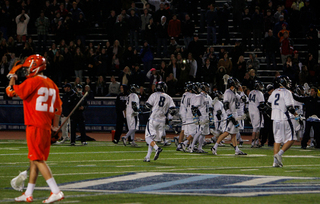 Sean Young walks off the field as Villanova celebrates its 11-10 win over Syracuse.