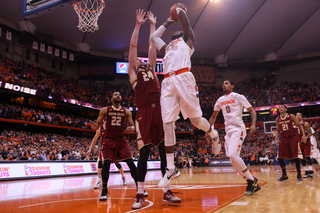 Christmas elevates over Clifford in the post as he tries to score. 