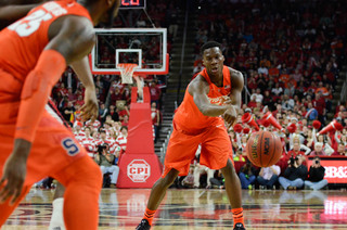 Tyler Roberson tries to feed Rakeem Christmas in the low post. It's a combo SU used often, as Roberson would pop out to the wing before feeding the senior forward.