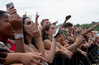 The crowd erupts in hoots and hollers as Yung Gravy changes from his blue and white button down into a Syracuse jersey. Students sang along to his music and put their arms up to dance along.